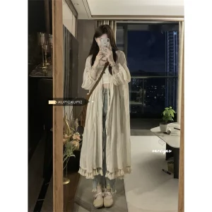 温柔小众长袖防晒开衫叠穿连衣裙女早秋设计感度假风宽松流苏裙子
